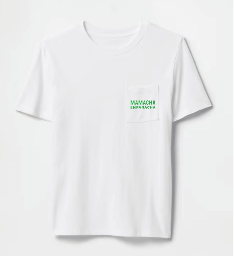 Front of a white Mamacha Empanacha pocket tee with the green logo on the pocket